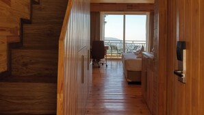 A wooden interior with a staircase leading to a balcony. - Royalpine Rosastays Kasauli (Kasauli)