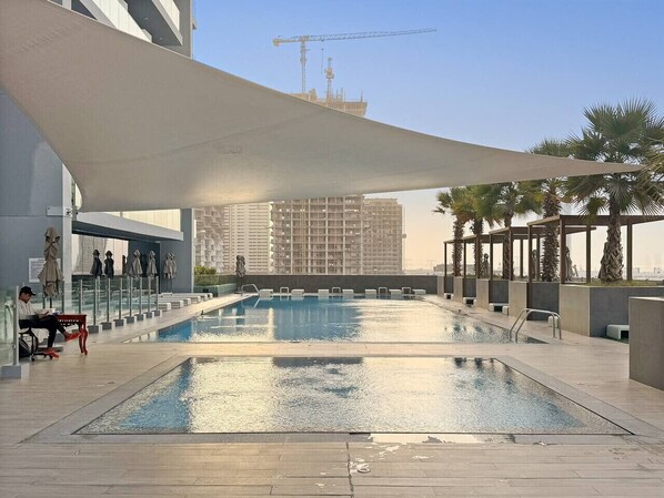 Pool - Chic JVC Studio in Dubai | Pool, Gym, Free Parking, City Views & Prime Location (JVC)