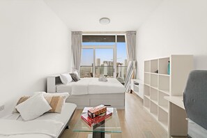 1 bedroom, iron/ironing board, WiFi, bed sheets - Chic JVC Studio in Dubai | Pool, Gym, Free Parking, City Views & Prime Location (JVC)