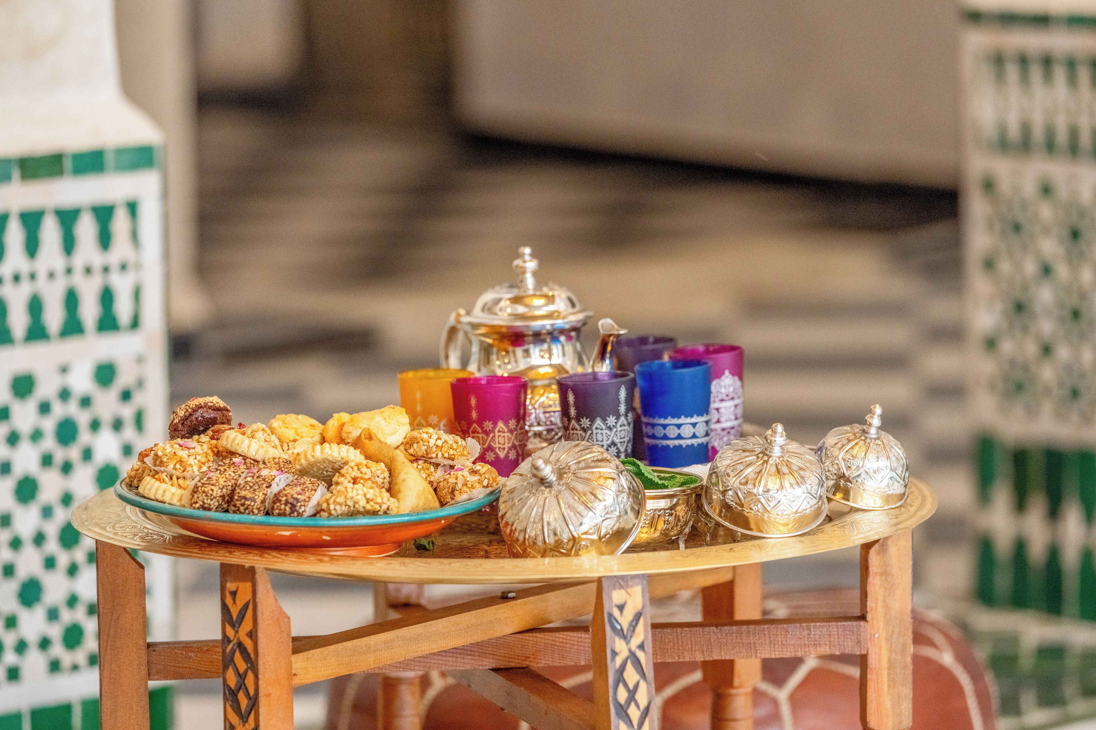 A table with a variety of food items and decorative objects.