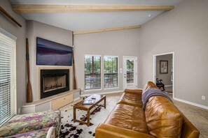 TV, fireplace, books, offices