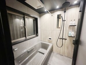 Shower, jetted tub, hair dryer, bidet