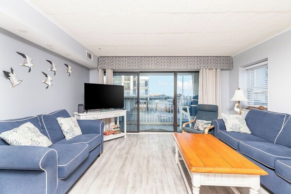 TV - Cozy 3 bedroom condo with wiFi, flat screen televisions, books, and a distant ocean view located uptown near mini golf and a movie theater and a mere stroll to the beach! (Ocean City)