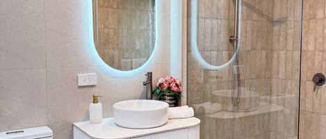 Shower, hair dryer, towels, soap