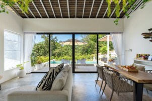 1 Bedroom Garden View Pool Villa | Living area | 50-inch Smart TV with digital channels, Netflix, streaming services