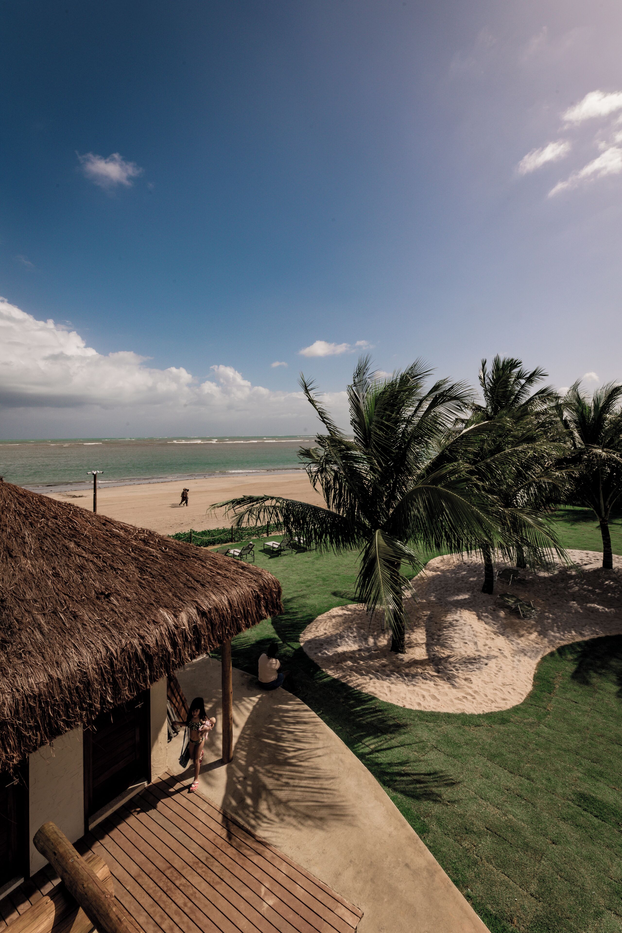 On the beach, white sand, sun-loungers, beach umbrellas