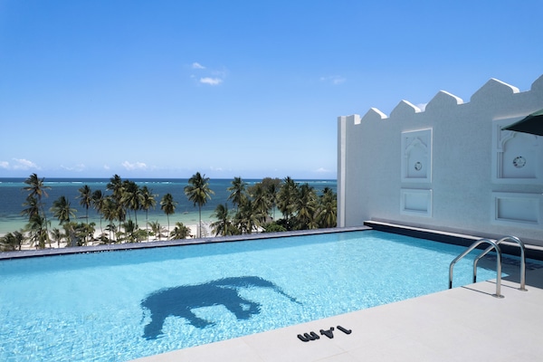 Indoor pool, 3 outdoor pools, open 8:00 AM to 7:00 PM, pool umbrellas