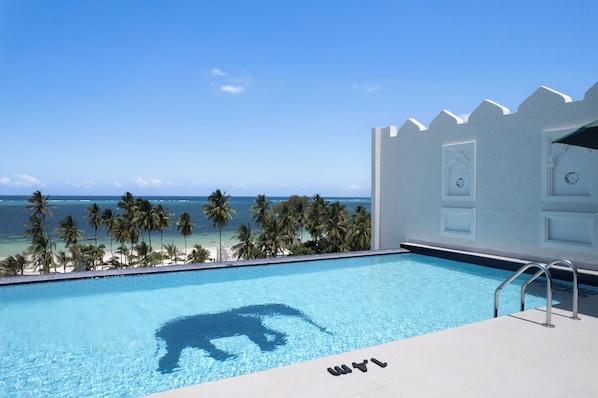 Indoor pool, 3 outdoor pools, open 8:00 AM to 7:00 PM, pool umbrellas