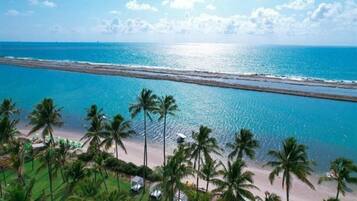 On the beach, sun-loungers, beach towels