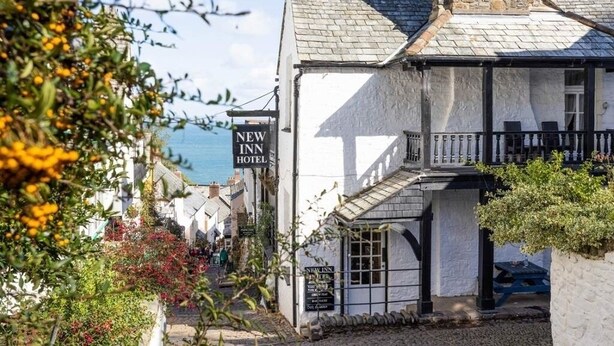 A white building with a black sign reading "NEW INN HOTEL". - Cottage with 3 ensuite bedrooms and Sea Views.  North Devon Heritage Coast. (Bideford)