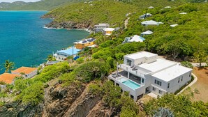 A coastal property with multiple buildings, a swimming pool, and a view of the sea. - Beautiful SeaCrown Estate-Oceanfront- 6BR 5.5BA with Pool (St Thomas)