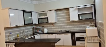 Spacious 3-bedroom apartment with WiFi, AC in charming Karachi