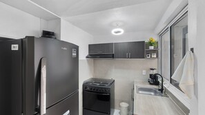 Family Chalet | Private kitchen | Full-size fridge, microwave, oven, cookware/dishes/utensils