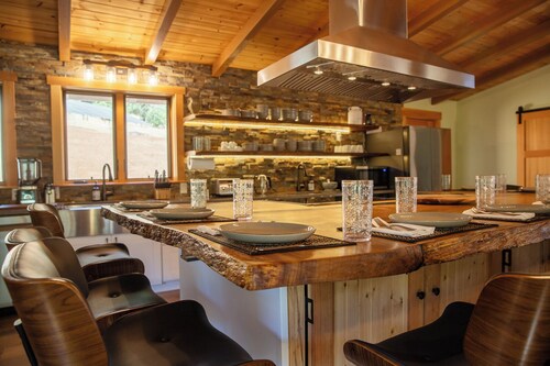 Private 40-acre retreat with creek, swimming hole, hot tub, fire pit, sleeps 18, dog-friendly, near golf & casinos.