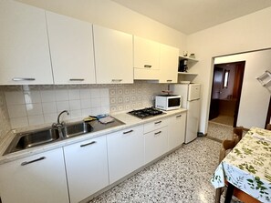 Fridge, microwave, cookware/dishes/utensils