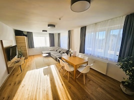 Deluxe Apartment, City View | Living area | 42-inch Smart TV with digital channels, toys, offices