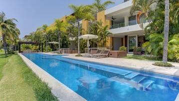 Outdoor pool, open 7:00 AM to 11:00 PM, pool loungers