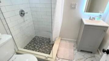 Shower, hair dryer, towels, soap