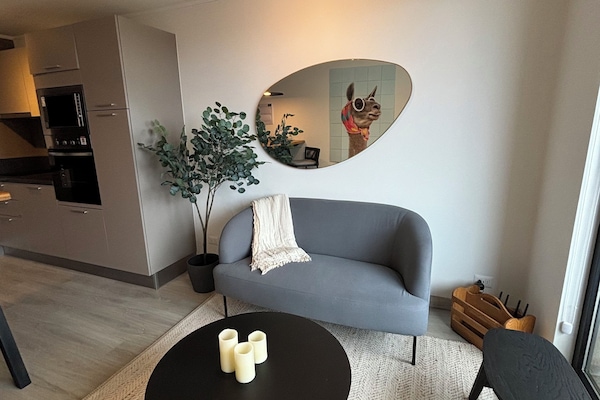 Apartment, Partial Lake View | Living area | Flat-screen TV