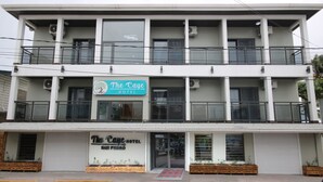 A two-story hotel with balconies and a sign reading "The Caye Hotel San Pedro". - The Caye Hotel San Pedro (San Pedro)