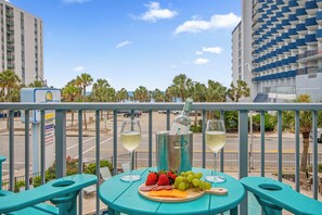 Outdoor dining - Oceanview 1 bdrm condo, pools, hot tubs, lazy river, WIFI, walk to attractions! (Myrtle Beach)