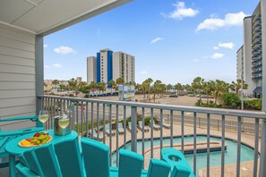 Outdoor dining - Oceanview 1 bdrm condo, pools, hot tubs, lazy river, WIFI, walk to attractions! (Myrtle Beach)