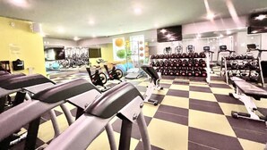 A gym with treadmills, stationary bikes, and weight machines. - The Spot that Ever Calls - Walk to OM & Square! (Oxford)