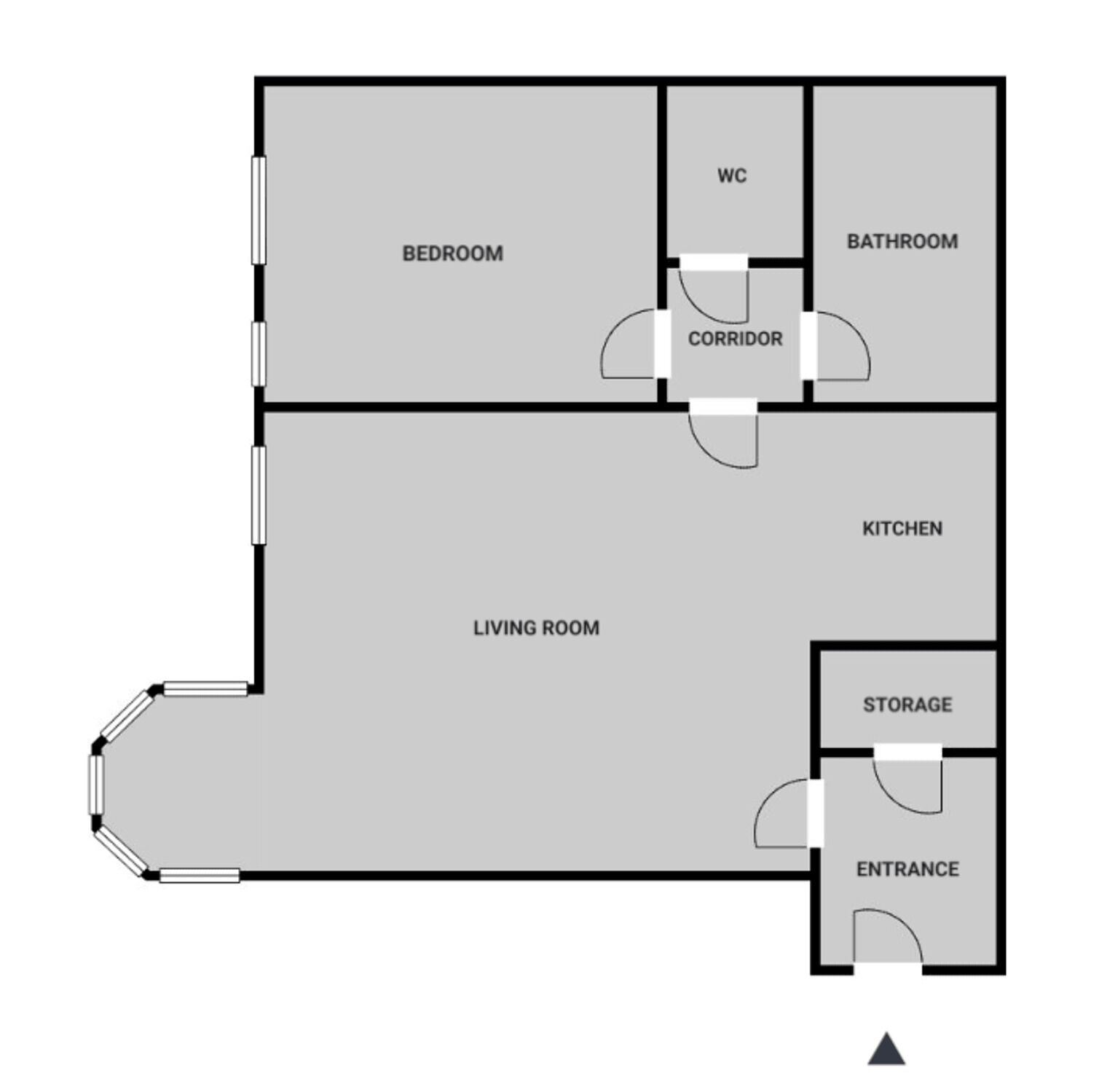 A floor plan with a bedroom, bathroom, kitchen, living room, and storage area.