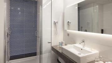 Combined shower/tub, hair dryer, slippers, soap
