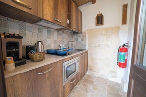 Fridge, microwave, stovetop, coffee/tea maker