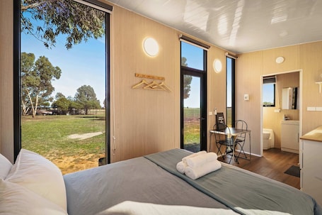 1 bedroom, bed sheets. Wareek Retreat by Tiny Away