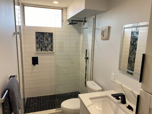 Shower, hair dryer, towels, soap