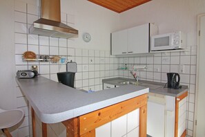 Departamento Confort, 1 habitación | Cocina privada | Refrigerador, microondas, horno y lavavajillas 