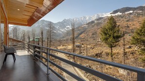 A balcony with a view of a mountainous landscape. - Treebo Premium Silverstone Resort With Mountain Valley View (Manali)