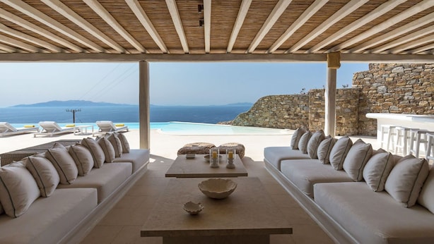 A covered outdoor seating area with a view of the sea and mountains. - Villa in Kalafati with 8 bedrooms sleeps 16 (Kalafati)