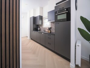 Microwave, dishwasher, dining tables
