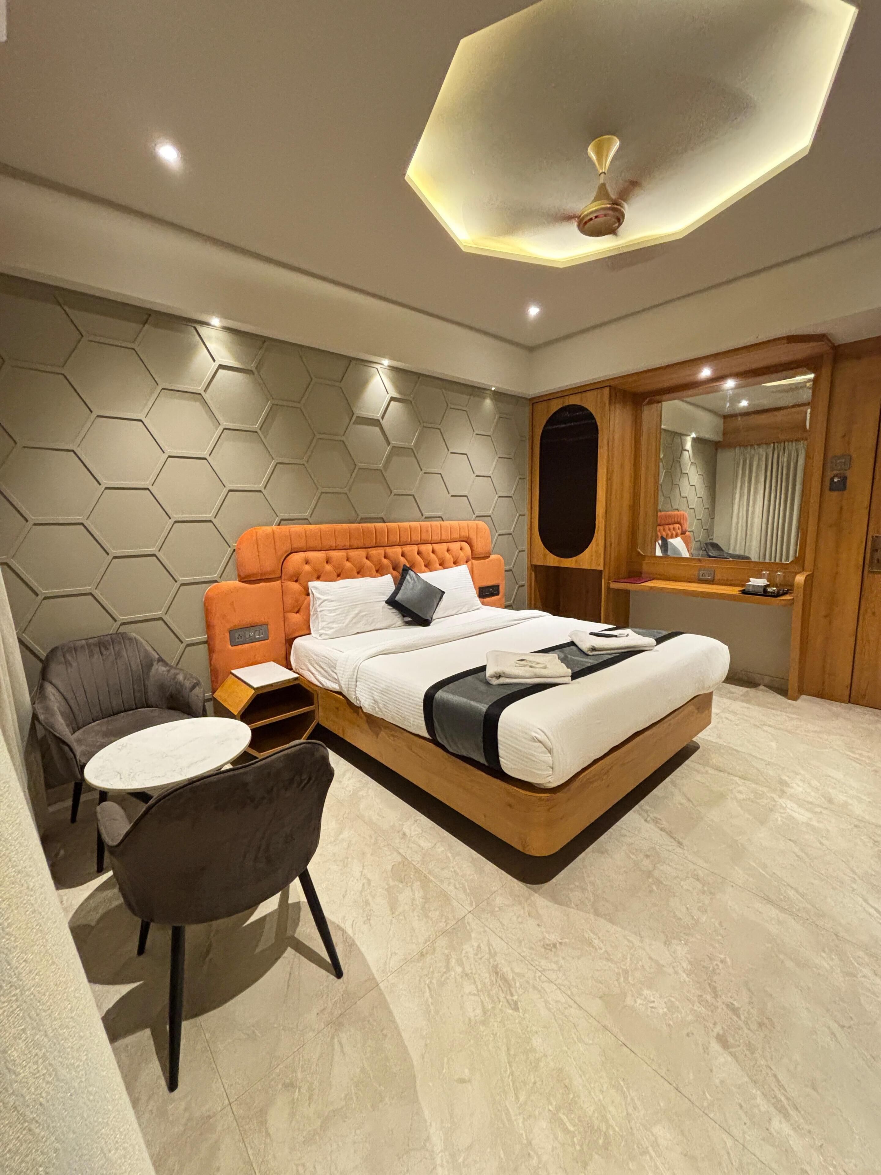 Desk, laptop workspace, bed sheets