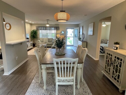 Cozy home w/golf cart, lanai, smart TVs, & prime location near town squares!