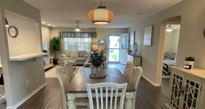 Cozy home w/golf cart, lanai, smart TVs, & prime location near town squares!