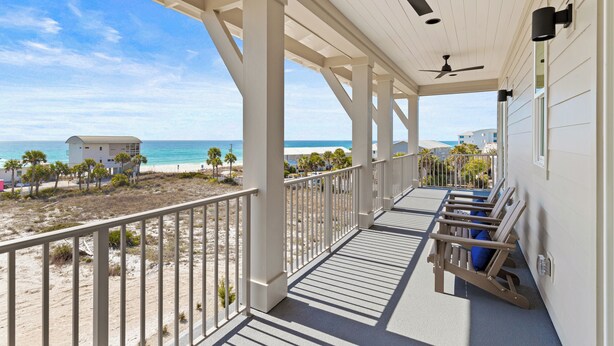 A covered balcony with a view of the beach and ocean, featuring ceiling fans and a railing. - Bikes, Close Beach Access, Gulf View, Private Pool (Inlet Beach)
