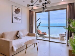 Apartment, 3 Bedrooms, Beach View | Living area | 45-inch Smart TV with digital channels - OLIU'S HOMESTAY - The Sóng Vũng Tàu (Ho Chi Minh City)