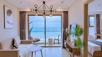 Apartment, 3 Bedrooms, Beach View | Living area | 45-inch Smart TV with digital channels