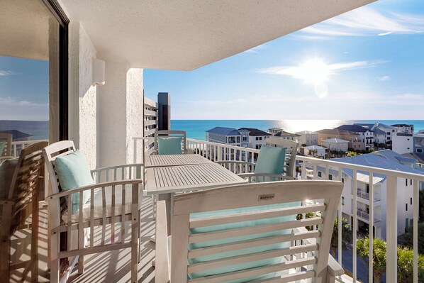 A balcony with a view of the ocean and neighboring buildings. - Mainsail 472 - Gulf Front Condo, Community Pool, Hot Tub, Free Beach Service! (Miramar Beach)