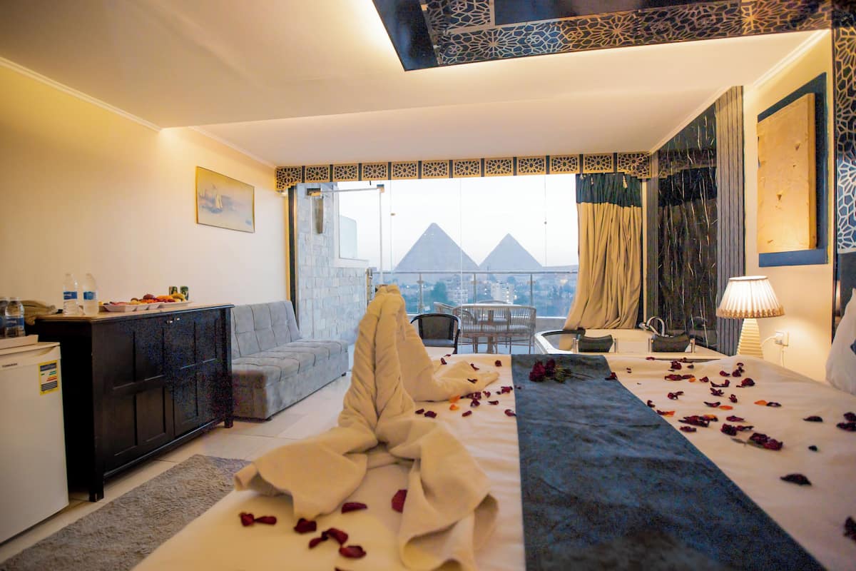 Deluxe Suite, Balcony | In-room safe, blackout drapes, iron/ironing board, free WiFi