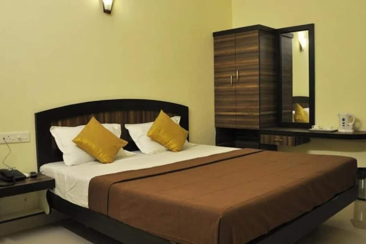 Premium bedding, desk, laptop workspace, soundproofing