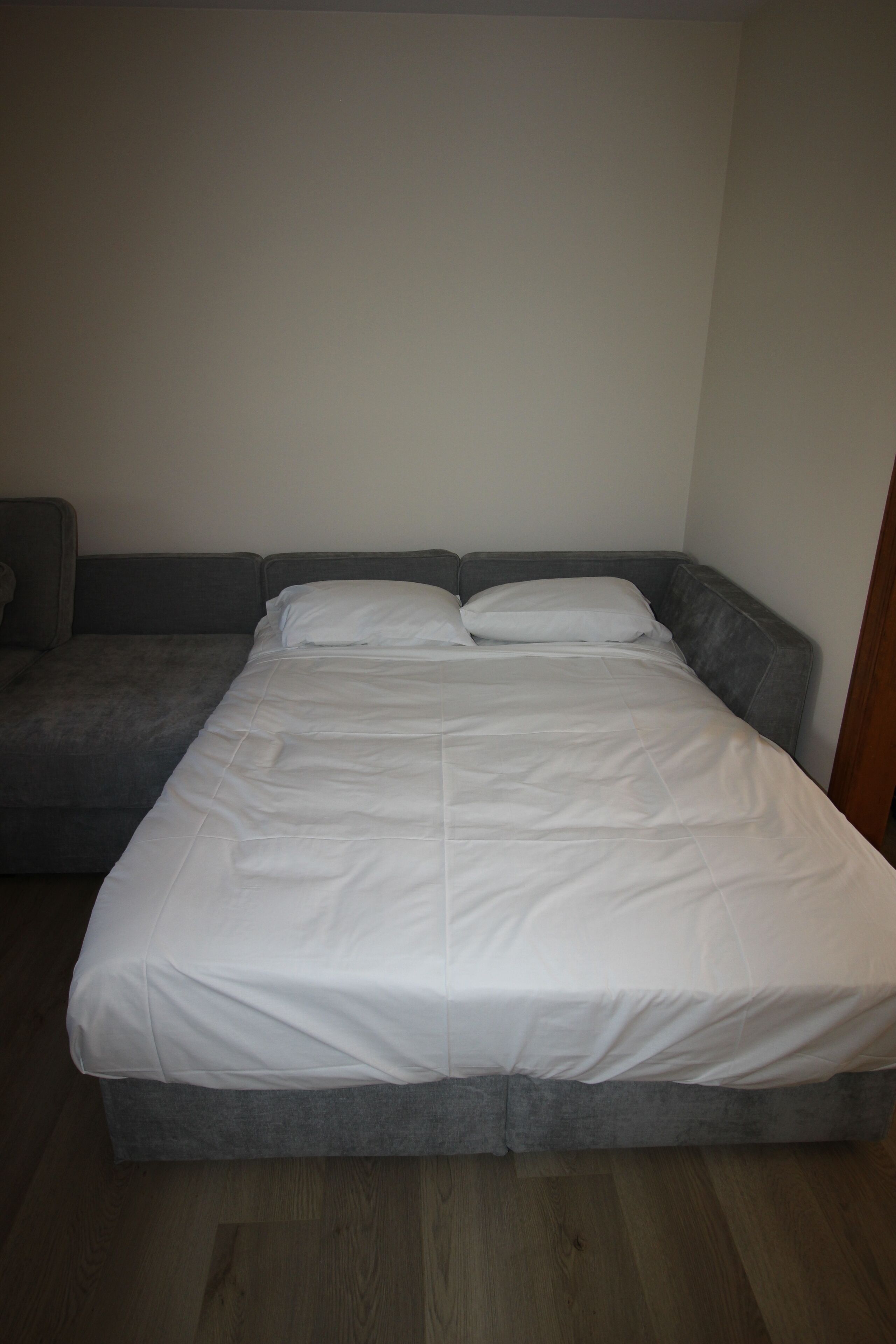 2 Queen beds formed w/ 4 Lovsac sectionals.  1 Bed in living rm; 2nd on 1st fl