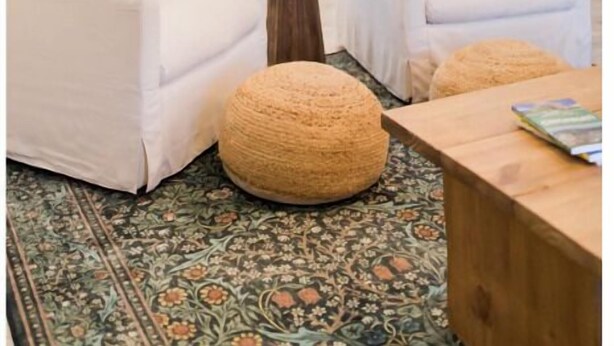 A modern living room with white sofas, a wooden coffee table, and a patterned rug. - The Lounge- Heated Private Bar, Hot Tub, Fire Pit, Sleeps 14 (Cincinnati)