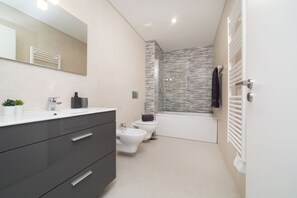 Hair dryer, bidet, towels, soap