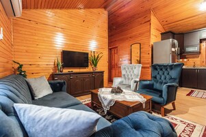 Comfort Tree House, 2 Bedrooms, Kitchen, Garden View | Living area | LCD TV, foosball, books