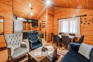 Comfort Tree House, 2 Bedrooms, Kitchen, Garden View | Living area | LCD TV, foosball, books